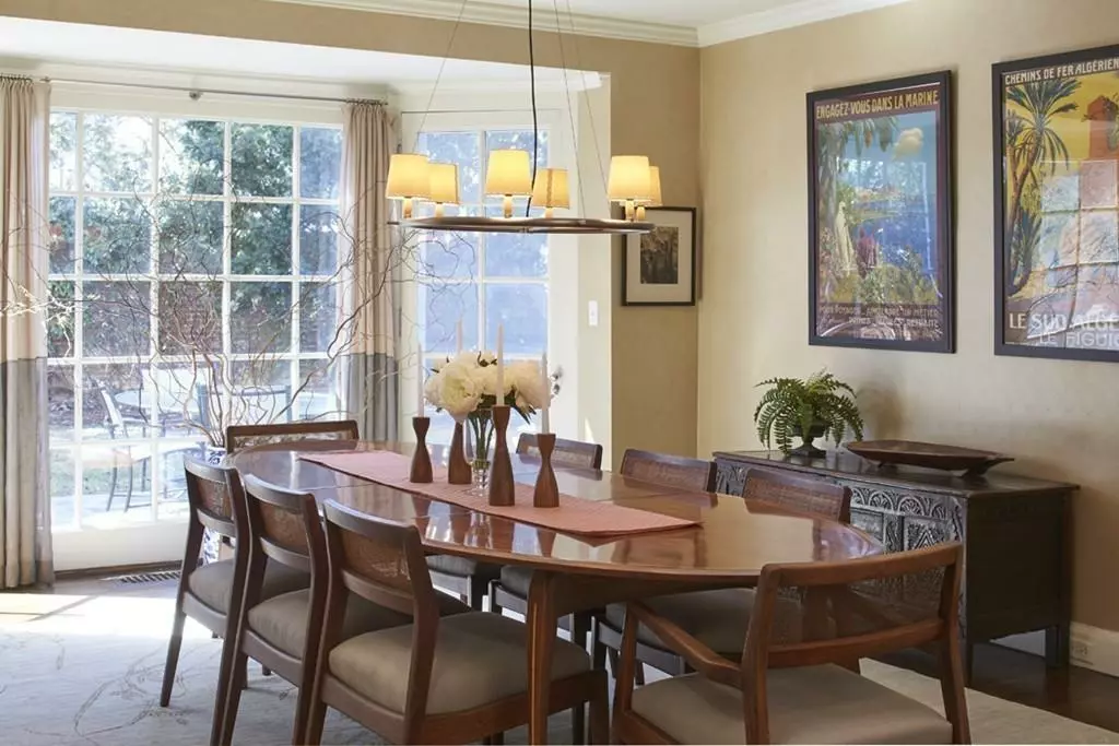 A dining room with a wooden table and chairs in Boston.