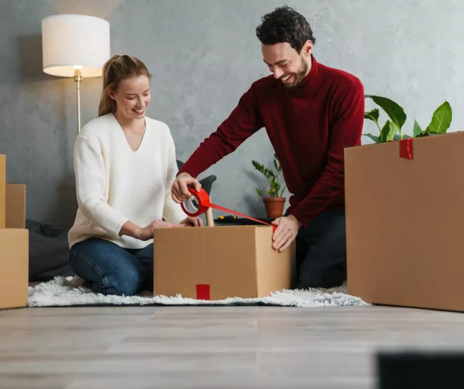 Newlyweds happily moving into their new home after a professional move in and move out cleaning service in Boston.
