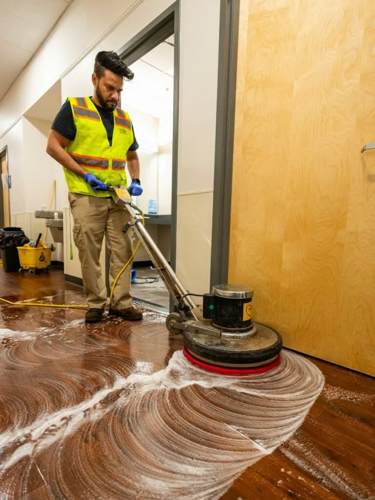 man cleaning a floor